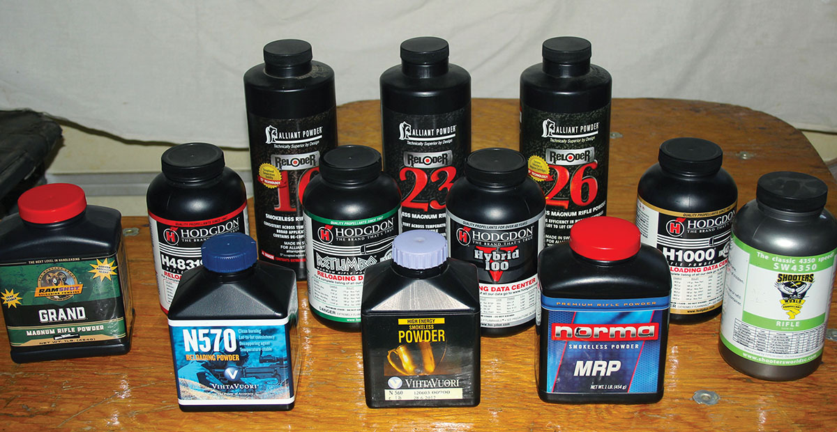 Powders used for testing, included (rear row, left to right) Alliant Reloder 16, Reloder 23 and Reloder 26; (middle row) Ramshot Grand and Hodgdon 4831sc, Retumbo, Hybrid 100V and H-1000; (front row) Vihtavuori N570 and N560, Norma MRP and Shooters World 4350.